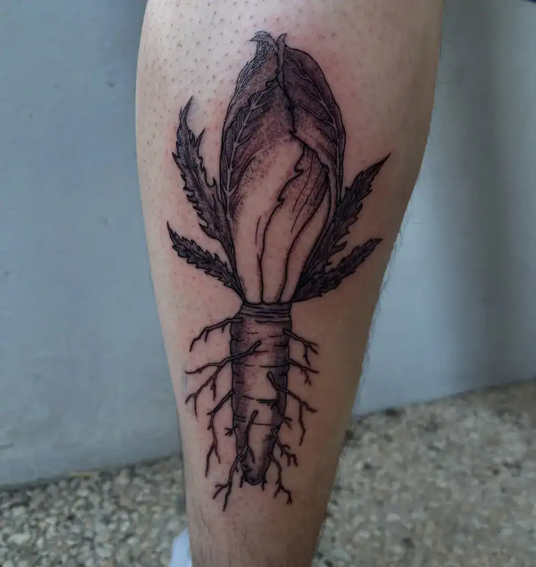 Photo d'un tatouage de chicon sur une jambe
